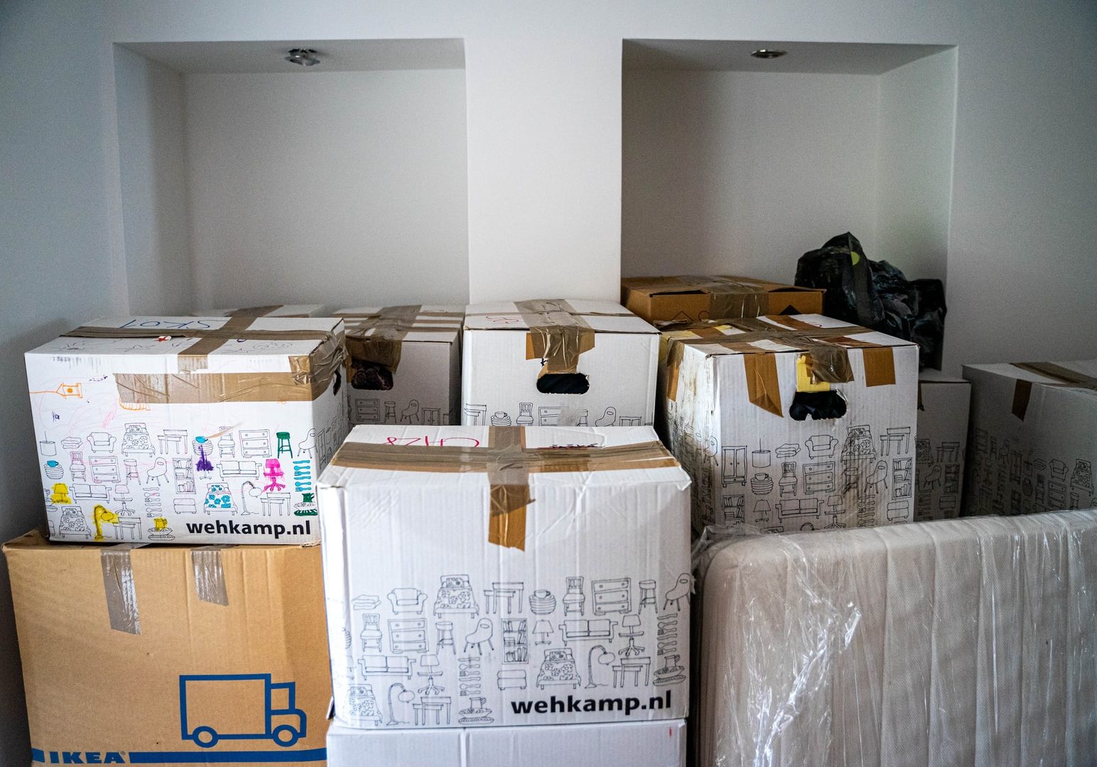 brown cardboard boxes on brown wooden table